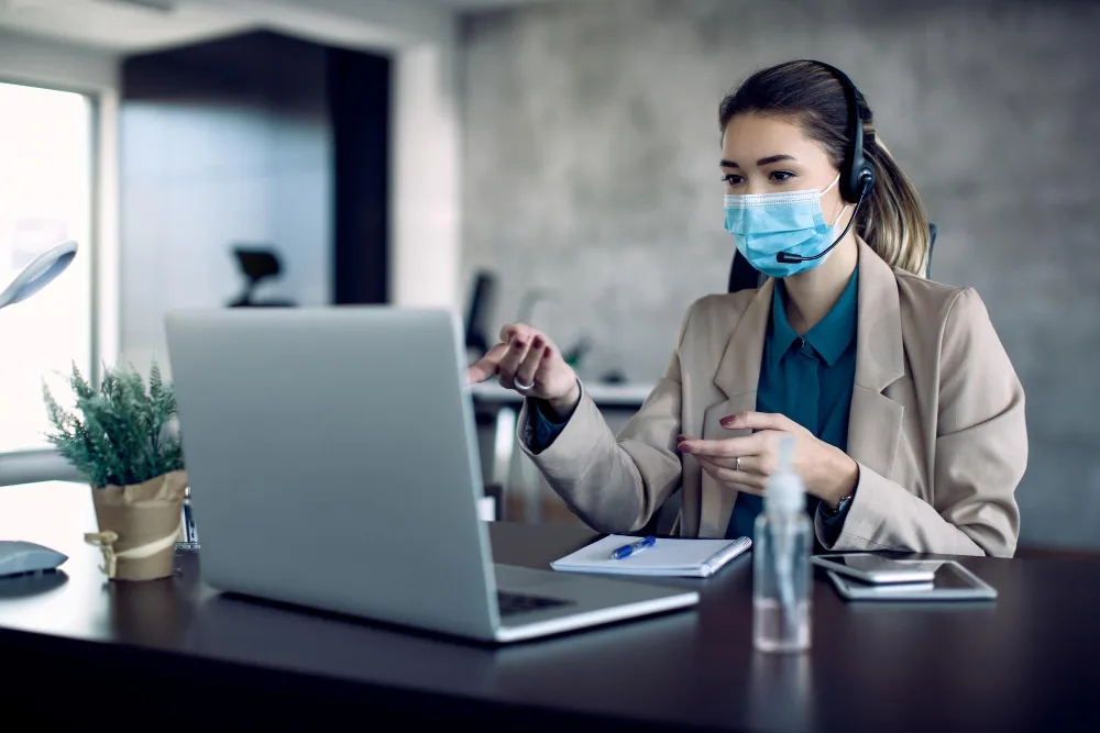 AI receptionist answering phone calls for a dental practice while the front desk team assists patients.