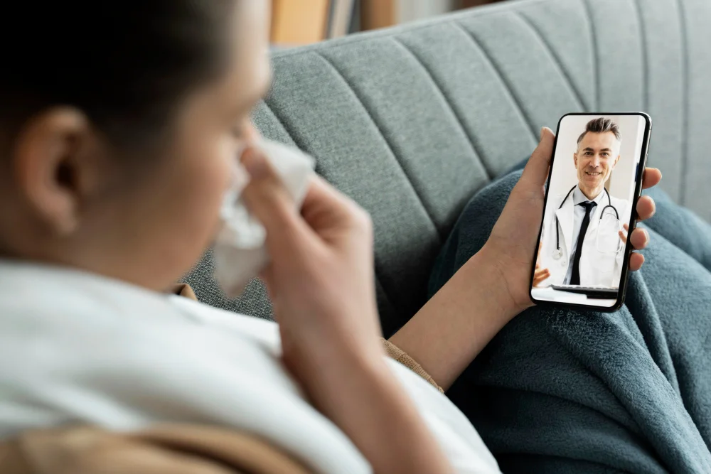 Patient reviewing a healthcare practice website on a smartphone before booking an appointment